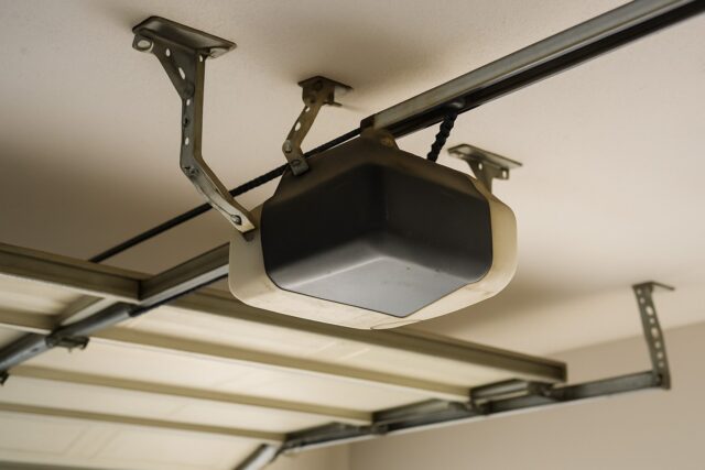 The Complete Guide to Garage Door Tune-Ups in Maine: Expert Tips from Alpine Garage Doors New England 1 Overhead opener inspected during a Garage door tune-up to ensure proper alignment and smooth door operation.